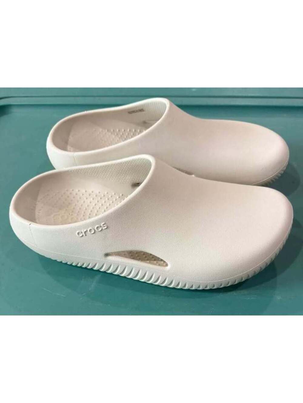 Like New W10 Crocs beige shoes